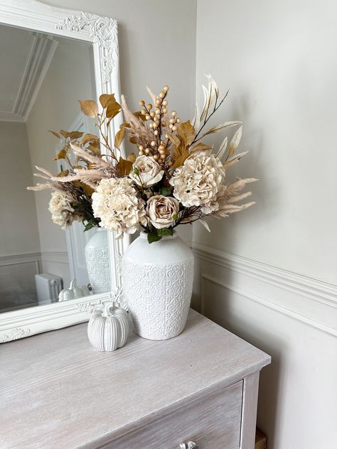 Embrace the season with a touch of faux florals! Link in bio #Autumnwreathforsale #Autumnwreath #Autumnvibes #falldecor #autumnwreath #fyp #autumnhomedecor #farmhousedesign Beige Vase With Flowers, Elegant Flower Arrangements, Autumn Florals, Eucalyptus Stems, Fall Flower Arrangements, Fall Arrangements, Fall Home, Artificial Flower Arrangements, Faux Florals