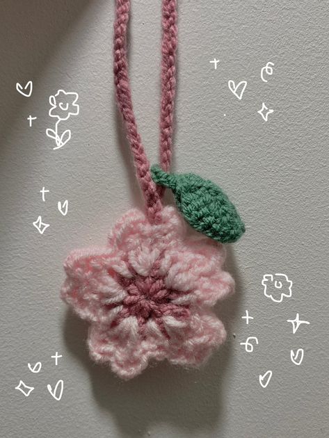 Adorable little Sakura/cherry blossom charm, perfect to glamourise your bag or act as a headphone wrap 🌷🌸 the loop may be adjusted accordingly and it is approximately 16cm in length. Made To Order Please keep in mind that delivery times are an estimate and if you have any further enquiries please do not hesitate to message me!  I also take other colour requests 🍓 Crochet Sakura Keychain, Handmade Gifts Tutorial, Sakura Crochet Pattern, Crochet Headphones Accessories, Headphone Charms Crochet, Crochet Pink Ideas, Headphone Crochet Accessories, Crochet Headphone Charm, Bag Charms Crochet