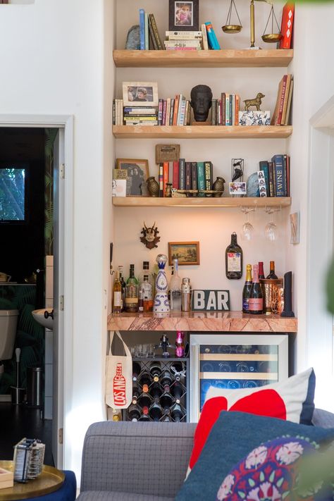 Dustin & Maya's Eclectic Hillside Home in Silver Lake Small Home Wine Bar, Bookshelf And Bar, Bookshelf With Bar, Bookshelf And Bar Combo, Built In Bookshelf Bar, Bar And Bookshelves, Bar Section In Living Room, Bar Nook In Living Room, Eclectic Bookshelf Styling