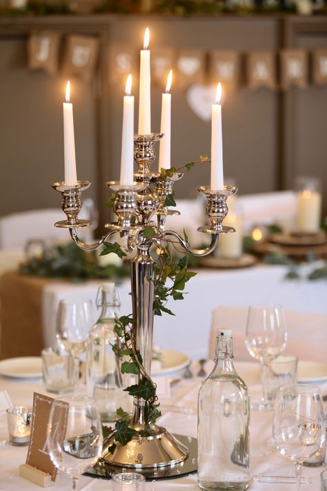 Nothing says elegant like a candelabra, it is simply a tale as old as time.  #wedding #weddinghire #weddingprops #weddingpropshop #candelabra #candles #taleasoldastime Simple Candelabra Centerpiece, Candleopera Centerpieces Wedding, Wedding Table Candelabras, Silver Candelabra Centerpiece, Candlebra Wedding, Wedding Candelabra Centerpiece, Candlebra Centerpiece, Candleabras Centerpiece, Candleabras Wedding