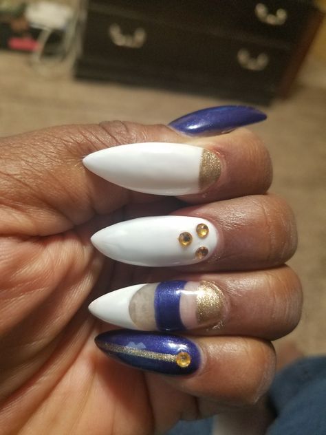 navy blue, white, and gold stiletto nails White And Gold Stiletto Nails, Navy Blue And Gold Nails, Blue And Gold Nails, Gold Stiletto Nails, Gold Stilettos, Navy Blue And Gold, Gold Nails, Stiletto Nails, Blue And Gold