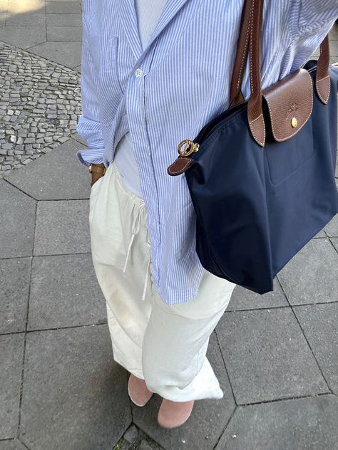 linen pants, striped blouse, longchamp bag, boston birkenstocks Styling Longchamp Bag, Blue Longchamp Bag Outfit, Long Champ Bag Outfit, Longchamp Bag Aesthetic, Longchamp Aesthetic, Longchamp Bag Outfit, Longchamp Style, Longchamp Outfit, Long Champ