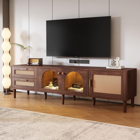 PRICES MAY VARY. Rattan Entertainment Center - This sleek rattan TV Stand with LED lights blends Mid-Century Modern and Scandinavian style, making it the ideal TV console for a wide range of modern decor. You'll love the rattan door/drawer face design that adds a tropical and stylish feel to your living room. Versatile Storage Space - This wooden TV stand provides plenty of storage options with 2 drawers and 3 cabinets, both of which are ideal for keeping your digital receiver, game consoles, an Indochine Tv Cabinet, Tv Stands Boho, Tv Stand For 80 Inch Tv, Slim Media Console, Mounted Tv Living Room Decor, Mcm Living Room With Tv, Media Console Cabinet, Mid Century Modern Living Room Masculine, Frame Tv Living Room Decor