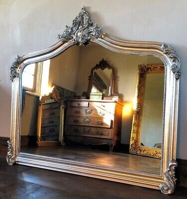 MirrorTraders.com This Mirror would make a lovely grand over-mantle mirror. The Annecy - Large Over Mantle - Antique Silver. Do not hang the mirror by picture wire of chain. Antique Gold. French Ivory / Cream. Beautifully hand finished in Antique Silver. Ornate Silver Mirror, Different Types Of Mirrors, French Victorian Decor, Medieval Mirror, Arch Fireplace, Outdoor Mirrors, Mirror Engraving, Art Nouveau Living Room, Mirror Over Fireplace