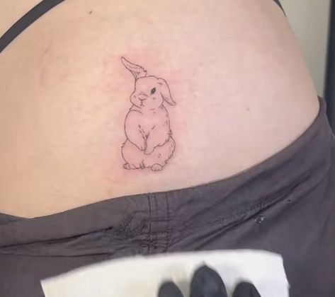 Bunny Hip Tattoo, Bunny Eating Strawberry Tattoo, Dainty Rabbit Tattoo, Bunny Rabbit Tattoo Small, Bunny Holding Flower Tattoo, Bunny Angel Tattoo, Red Rabbit Tattoo, Holland Lop Bunny Tattoo, Small Bunny Tattoo Simple