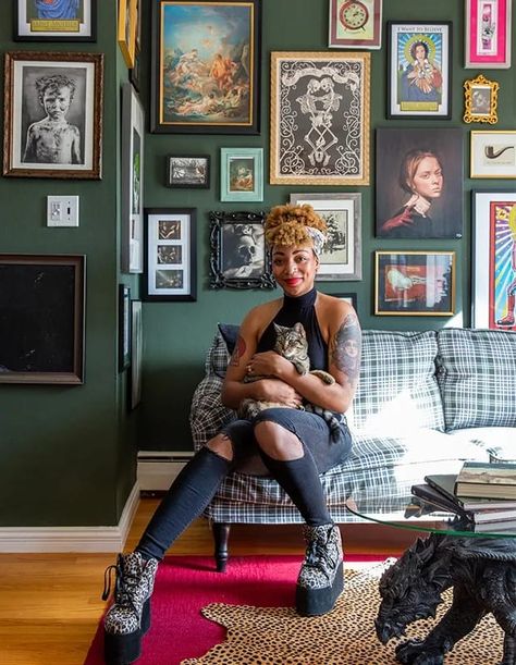 Maximalist designer Carmen René Smith chose a deep green wall color as the anchor for this eclectic gallery wall in a San Fransisco home. Instead of overpowering the space, the bold choice grounds the room with warmth and elegance. | Photographer: Meghan Caudill | Designer: Carmen René Smith, Aquilo Interiors Maximalist Gallery Wall, Green Wall Color, Herringbone Wall, Graphic Pillow, Dark Green Walls, Eclectic Gallery Wall, Fine Photography, Green Sofa, Dark Walls