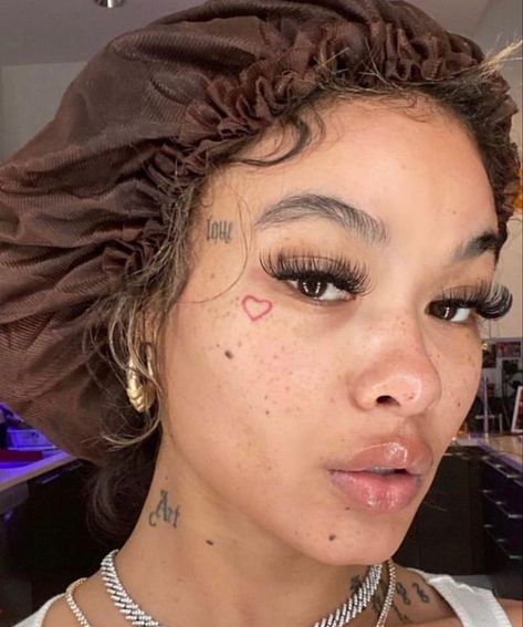 India Love Face Tattoos, Lil Face Tattoos, Love Heart Face Tattoo, Girls With Face Tattoos, Fake Face Tattoo, Cute Face Tats, Pretty Face Tattoos, Under Eye Tattoo, Small Face Tattoos