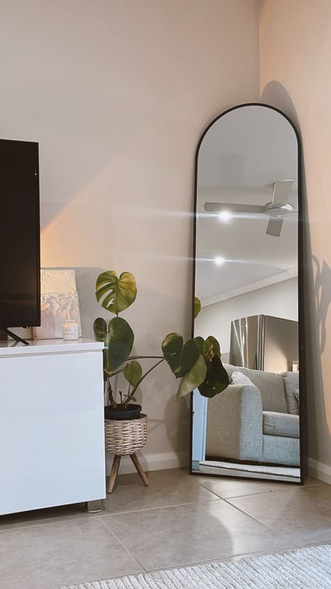 Arch Mirror In Corner, Full Length Mirror With Plants, Arch Mirror Aesthetic, Mirror Apartment Decor, Arch Shaped Mirrors, Arch Standing Mirror, Ground Mirror Bedroom, Arch Mirror In Bedroom, Black Arched Mirror Living Room