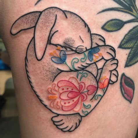 tattoodo | Bunny tattoo by Valeria Marinaci #ValeriaMarinaci #bunnytattoo #color #linework #illustrative #folktraditional #flowers #floral #bunny #rabbit #nature #animal #easter | Tattoodo Bjd Tattoo, Hase Tattoos, Cute Animal Tattoos, Bunny Tattoo, Rabbit Tattoo, Waist Tattoos, Bunny Tattoos, Explore Tattoo, Muster Tattoos