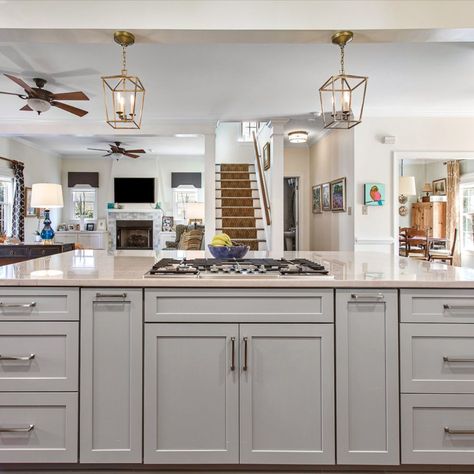 Cabinets- Double stack cabinets in 410F Linen by Waypoint Living Space with a 410F Painted Stone Island

Countertops- Diamond White Quartzite

Features: Cooktop in island, built in bench seat, double oven, warm accents

#greycabinets #kitchenisland #stackedcabinets #waypoint #whitecabinets
#greyisland #cooktop #faucet #benchseat Kitchen Cooktop Island, Kitchens With Stove In Island, Large Island With Cooktop And Seating, Islands With Stove Tops, Large Kitchen Island With Cooktop, Kitchen Island With Cooktop And Seating, Kitchen Island Stovetop, Island With Stove And Oven, Kitchen Island Cooktop