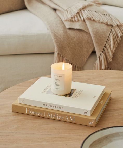 Topanga Glass Candle, Jenni Kayne on coffee table books including Gatherin gand Houses by Atelier AM. Candle In Home Decor, Jenni Kayne Candle, Candles On Shelf, Candle Pillars Decor, Candle Styling Photography, Candle Photography Inspiration, Candle Photography Ideas, Atelier Am, Candle Photography