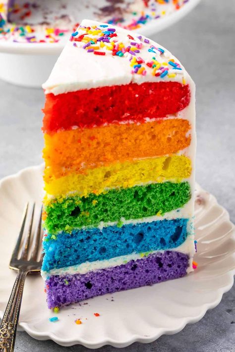 The perfect Rainbow Cake recipe starts with a cake mix and has homemade frosting. No one will know this cake is semi-homemade and it's the perfect rainbow colors for any rainbow party! Zoe Cake, Rainbow Cake Recipe, Rainbow Layer Cakes, 4th Birthday Cakes, Homemade Frosting, Semi Homemade, Rainbow Food, White Cake Mixes, Yummy Comfort Food