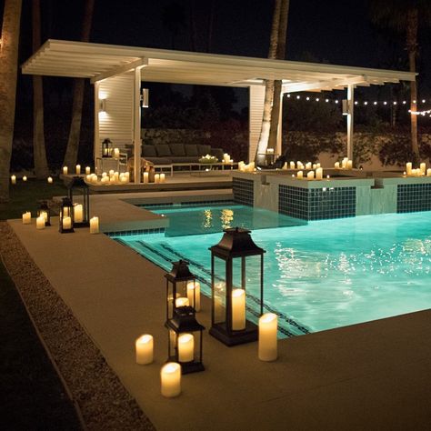 Poolside candle light Backyard Lighting With Pool, Candles Around Pool, Lanterns In Pool, Pool Decoration Wedding, Pool Side Decorating Ideas Backyard, Pool Side Wedding Decor, Pool Decorations For Party Night, Lanterns Around Pool, Poolside Lighting