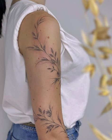 Vines Arm Sleeve Tattoo, Poppy Arm Wrap Tattoo, Leafy Half Sleeve Tattoo, Flower Tattoos Around Arm, Shoulder Vine Tattoo Stencil, Airy Tattoos For Women, Dainty Floral Arm Wrap Tattoo, Black And Grey Vine Tattoo, Shoulder Foliage Tattoo