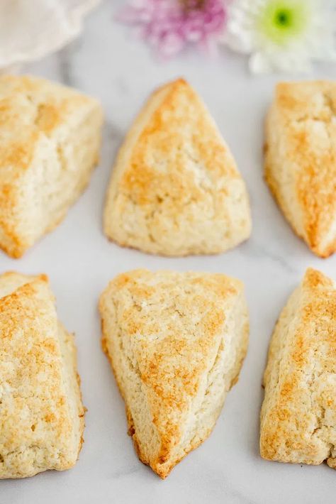 place the scones on a baking sheet lined with parchment paper or a silicone baking mat and place the baking sheet in the freezer for 5-10 minutes so that the dough is thoroughly chilled.  Once it’s nice and cold, brush the tops of the scones with a little heavy whipping cream. If you don’t plan to add a glaze on top, you can sprinkle them with a little coarse sugar Scone Recipe With Heavy Cream, Easy Breakfast Sides, Dessert Scones, Tender Scones, Cream Scones Recipe, Best Scone Recipe, Breakfast Sides, Scones Recipe Easy, Homemade Scones