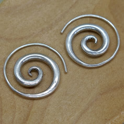 "Handmade Sterling Silver Spiral Earrings - Simple Rustic Thick Chunky swirl Tribal earrings ,\"fake Gauges\", For Women or Men Earrings Dimensions: Size: 1\" / 2.5cm - The thinner part is of the spiral is about 1mm (a normal earring's hook size), this part is about about 1.5\" / 4cm long. We also have similar versions of theses earrings: https://www.etsy.com/listing/480514617 https://www.etsy.com/listing/205519371 Weight: 0.265oz / 8gr Metal Purity: 95% Silver (Purer than 925 Sterling Silver) T Dope Jewelry, Spiral Earrings, Earrings Simple, Funky Jewelry, Jewelry Lookbook, Men Earrings, Party Jewelry, Jewelry Inspo, Simple Earrings