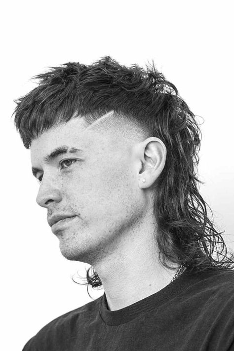 The mullet, a hairstyle that first gained prominence in the 1980s, is making a bold comeback. This iconic 'business in the front, party in the back' look has evolved over the years, adapting to modern trends while staying true to its rebellious roots. Today, the mullet is more versatile than ever, offering a variety of styles that suit different tastes and personalities. Here are 21 of the best mullet hairstyles for men, each offering a fresh take on this retro classic. 1. The Classic Mullet - Layered Mullet Men, Long Mullet Haircut, Long Mullet Men, Modern Mullet Men, Modern Mullet Mens, Male Mullet, Mullet Hairstyle Mens, Classic Mullet, Haircuts Male