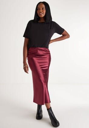 Add some style to your new season wardrobe with this gorgeous burgundy satin midi skirt. With a comfortable elasticated waist and classic a-line cut, this stylish skirt is ideal for parties or special occasions.• Silky satin-feel fabric• Elasticated waist• Flattering a-line cut• Midi length Burgundy Slip Skirt Outfit, Red Satin Skirt, Slip Skirt Outfit, Silk Skirt Outfit, Satin Skirt Outfit, Red Midi Skirt, Burgundy Skirt, Stylish Skirts, Autumn Colours