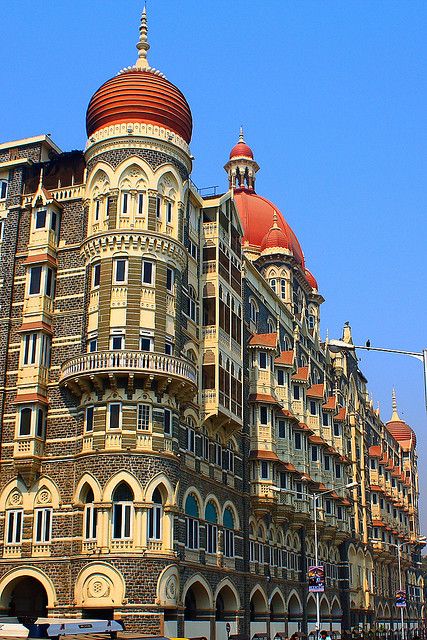 The Taj Mahal Palace hotel resort was commissioned by (Tata) and first opened its doors to guests on December 16, 1903. The original Indian architects were Sitaram Khanderao Vaidya and D. N. Mirza, but the project was completed by an English engineer W. A. Chambers. This was one of the places where terrorists struck on the night of 26th Nov. '08. It took the National Security Gaurds (NSG) commandos 60 hrs. to clear the building. British Architecture In India, Taj Palace Mumbai, Taj Mahal Palace Hotel Mumbai, Taj Hotel Mumbai, Byzantine Design, Taj Hotel, India Architecture, Taj Mahal India, Amazing India