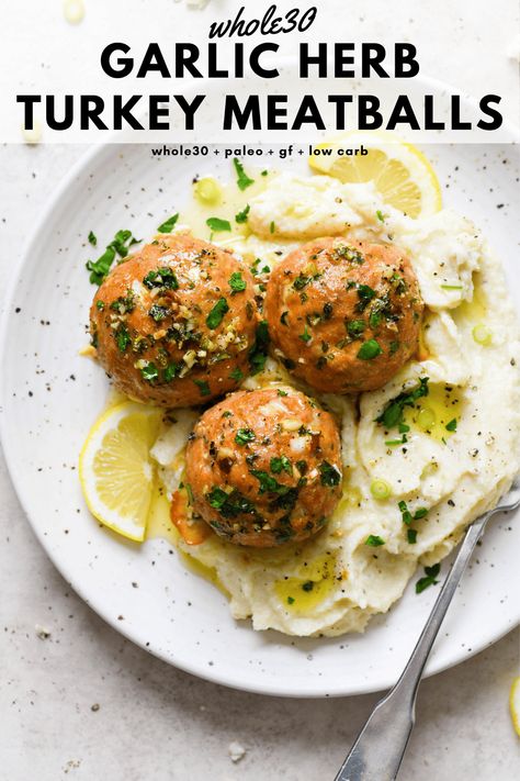 These baked whole30 garlic herb turkey meatballs are a tasty protein rich main dish that are made with ground turkey, fresh herbs, garlic, lemon, and ghee. Perfectly balanced, cooked to perfection, and made without cheese or breadcrumbs. Whole30, paleo, gluten free, low carb + keto friendly. #whole30recipes #turkeymeatballs #glutenfreedairyfree #lowcarb #ketofriendly Whole 30 Turkey, Garlic Herb Turkey, Whole30 Turkey Meatballs, Paleo Turkey Meatballs, Whole 30 Meatballs, Gluten Free Turkey Meatballs, Turkey Meatballs Recipe, Paleo Turkey, Ground Turkey Meatballs