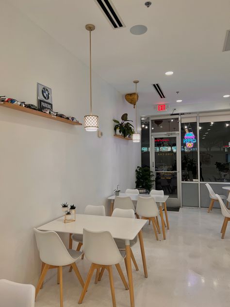 cafe boba aesthetic white modern cozy plants minimal Coffee Shop White Design, Cafe Decoration Ideas Coffee Shop Modern, White Coffee Shop Aesthetic, Minimalist Cafe Aesthetic, White And Wood Coffee Shop, Small Cafe Interior Simple, Boba Cafe Aesthetic, Boba Shop Interior Design, Small Cafe Design Ideas Simple