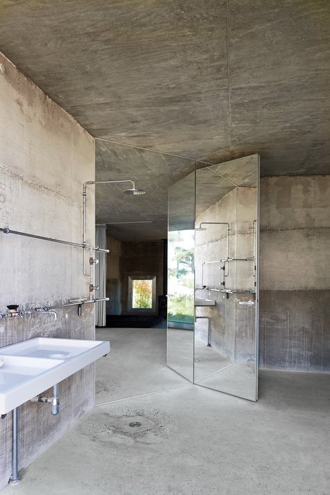 Inside Arno Brandlhuber’s Potsdam Bunker - The New York Times Industrial Shower Doors, Bathroom Scandinavian Style, Industrial Bathroom Design, Cement Bathroom, Industrial Showers, Urban Industrial Decor, Loft Designs, Industrial Mirrors, Industrial Bathroom