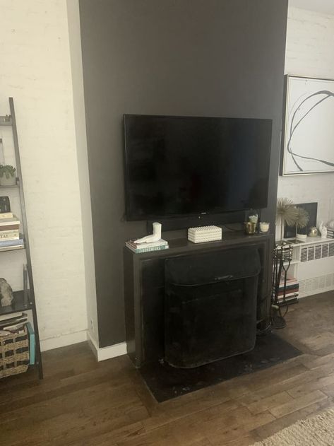 How to Hide a Flatscreen Television in Your Living Room | Apartment Therapy PAINT BEHIND TV SHERWIN WILLIAMS BLACK MAGIC AND IT ISNT EYESORE Sherwin Williams Black Magic, Sherwin Williams Black, Wall Behind Tv, Fireplace Accent Walls, Living Room Apartment, Paint Fireplace, Black Tv, Austin Homes, Paint Matching