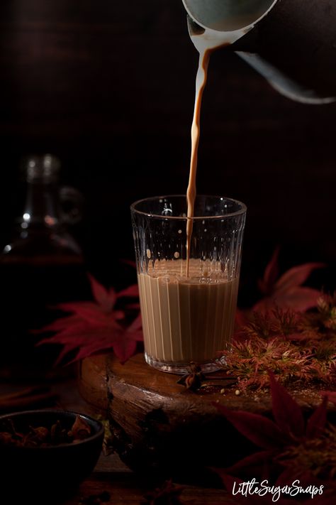 Rum masala chai being poured into a glass with spices and red leaves alongide. Bottle of rum in the background Chai Spice Recipe, Masala Chai Recipe, Chai Recipe, Beverage Recipes, Best Cocktail Recipes, Night Food, Spice Tea, Masala Chai, Chai Spice