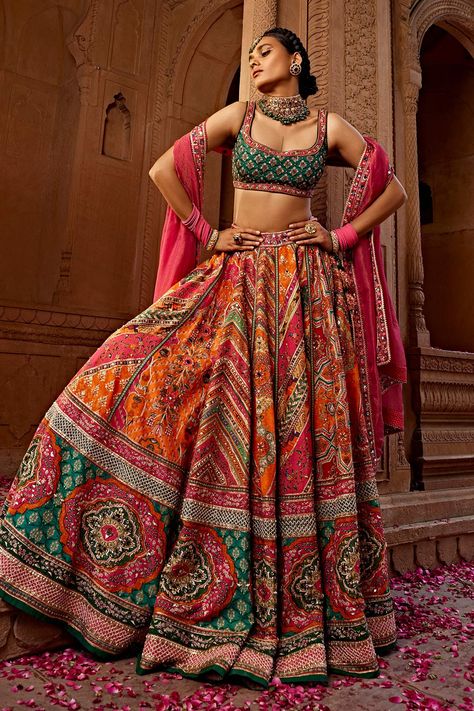 Shop for these amazing collections of Multi Color Blouse And Lehenga Raw Silk Print Floral Scoop Aadhya Bridal Set For Women by Kalista online at Aza Fashions. Multi Color Lehenga Ghagra Choli, Anita Dongre Printed Lehenga, Multi Color Mehendi Outfit, Orange Lengha Color Combos, Multicolor Lehenga Bridal, Multi Colour Lehenga Indian Weddings, Semi Traditional Outfits For Women, Orange Haldi Outfit, Bridal Mehendi Dress