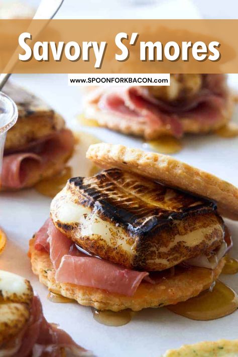 Prosciutto, melty brie cheese on a herb and cheese cookie drizzled with honey... need I say more? These Savory S'mores are so easy to make and super delicious, the perfect sweet and salty appetizer for any party. Pop over to our site for the recipe. | brie recipes | finger foods | party food | appetizer recipes | christmas appetizers | christmas recipes | smores | Sweet And Savory Smores, Fireside Savory S’mores, Savory Smores Ideas, Savory Smores Campfire, Brie Smores, Savory Smores Board, Camp Themed Food, S’more Ideas, Savory Smores Cheese