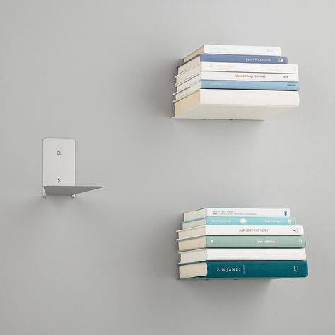 A set of floating shelves that turns books (the most beautiful things of all!) into storage units in and of themselves. Floating Books, Floating Bookshelf, Floating Bookshelves, Decorative Shelving, Wall Bookshelves, The Container Store, Bookshelves Diy, Estantes Flotantes, Shelves In Bedroom