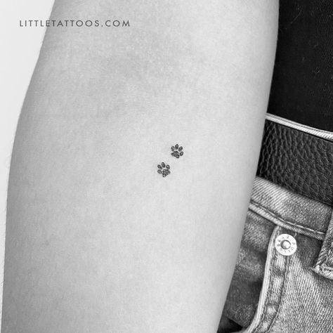 Set of three minimalist tiny pet paw print couple temporary tattoos. Paw print tattoos are a popular motif that can be chosen for a variety of reasons. Regardless of your reason for considering this type of tattoo, our dog paw print pair temporary tattoo offers you the ideal way to try before you buy. Our eco-friendly two pawprints fake tattoo features two tiny canine dog prints in black soy-based ink. With its small size, this is a design that will fit anywhere on your body. Don’t worry, you ge Tattoos Honoring Pets, Dog Tattoo Designs For Women, Two Paw Print Tattoo, Small Tattoos For Pets, Tiny Paw Print Tattoo Cats, Minimalistic Animal Tattoo, Tiny Paw Tattoo, Kitty Paws Tattoo, Mini Paw Print Tattoo