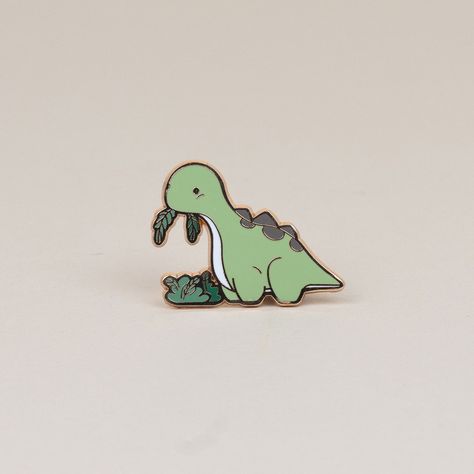 Who can resist that cute face? Not even the fussiest of eaters will be able to turn down their veggies when they see this adorable Bronti enamel pin. It's the perfect way to show your love for all things green! Size: 1.2" x 1.6" Dinosaur Pin, All Things Green, Enamel Pin Collection, Backpack Pins, Jacket Pins, Pretty Pins, Cute Face, Cool Pins, Sticker Patches