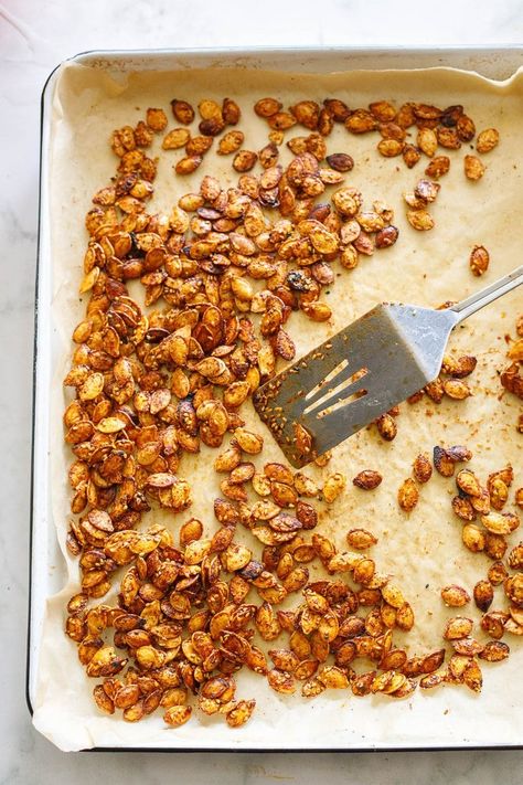 Sweet and savory, Maple Roasted Pumpkin Seeds with smoked paprika, cumin, cayenne and cinnamon. A tasty vegan snack, perfect for fall. Roasted Pumkin Seeds, Maple Roasted Pumpkin Seeds, Pumpkin Seeds Baked, Carving A Pumpkin, Savoury Snacks, Vegan Snack, Roasted Pumpkin, Roasted Pumpkin Seeds, Roast Pumpkin