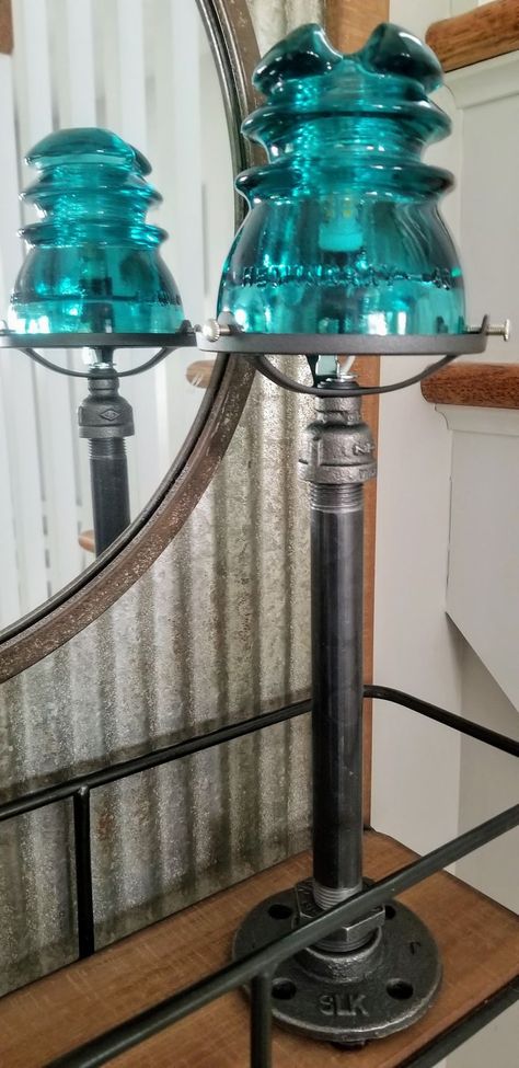 Cool industrial glass insulator table or desk lamp! Unique one-of-a-kind lamp was handcrafted in my shop using industrial pipe and vintage Hemingray blue-green glass insulator. Very high quality, includes solid metal holder, cord with switch, long lasting LED bulb and felt pads to protect your furniture. This unique insulator is over 75 years old and may have some imperfections, but these just add to the character! Emits a warm beautiful light. Industrial Pipe Table, Insulator Lights, Table Lamp Glass, Pipe Table, Industrial Table Lamp, Steampunk Lamp, Pipe Lamp, Lamp Glass, Glass Insulators