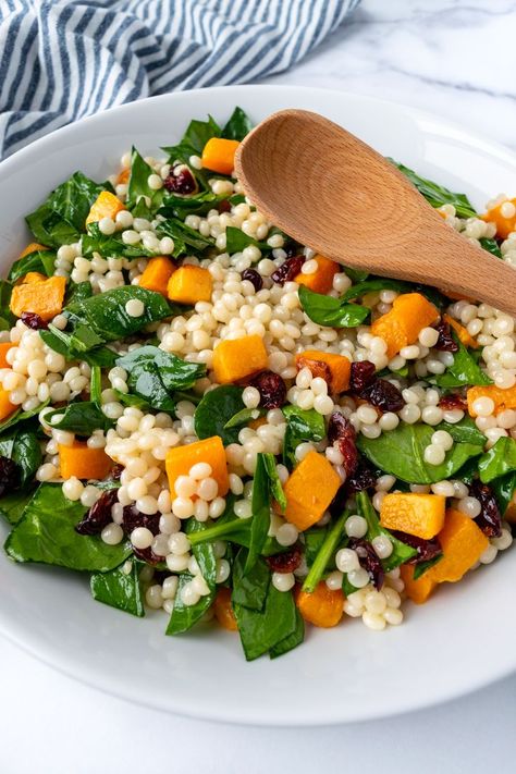 Butternut Squash Couscous Salad in a white serving bowl with a wooden spoon. Butternut Squash Couscous, Pearl Couscous Salad, Butternut Squash Cubes, Pearl Couscous, Autumn Side Dishes, Meatless Monday Recipes, Squash Salad, Couscous Recipes, Ras El Hanout