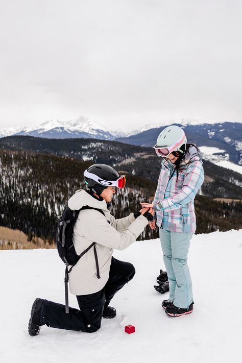 Couple in snowboarding attire. A proposal down on one knee as he puts the ring on her finger on top of the ski mountain. Snowboarding Proposal, Couple Skiing Pictures, Ski Proposal, Colorado Proposal, Colorado Snowboarding, Vail Ski Resort, Breckenridge Ski Resort, Ski Wedding, Vail Skiing