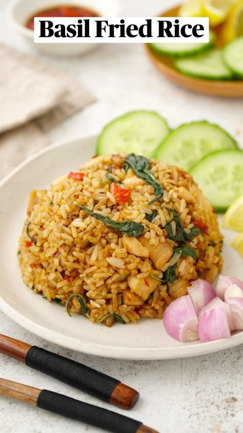 The best Thai Basil Fried Rice recipe made with jasmine rice, chicken, fragrant Thai basil, fresh chilies, and a delicious authentic sauce. This dish packs spicy, sweet, and savory flavors into one quick and easy weeknight dinner, ready in just 20 minutes! Thai Rice Recipes, Fancy Rice, Thai Basil Recipes, Thai Basil Fried Rice, Authentic Asian Dishes, Basil Fried Rice, Jasmine Rice Recipes, Rice Meals, Rice Recipes Vegan