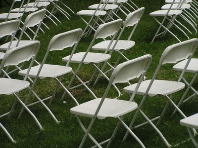 How to make wedding chair covers. When I was looking at rental prices renting ugly chairs along with chair covers cost more than renting slightly better chairs that I still didn't like so here is an article on how to make chair covers. Diy Wedding Chair Covers, Diy Folding Chair Covers, Plastic Chair Covers, Wedding Chairs Diy, Diy Chair Covers, Wedding Reception Chairs, Fold Up Chairs, Decorate Wedding, Comfy Reading Chair