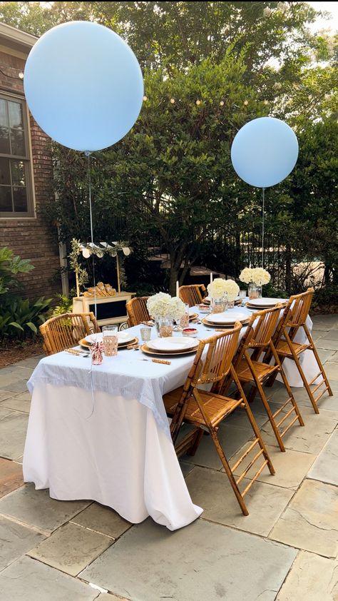 Garden party baby shower for a baby boy. Bamboo chairs, blue and white stripe table cloth, rattan cups, bamboo cutlery Boy Tea Party Baby Shower Ideas, Boy Baby Shower Tea Party, Baby Shower At Restaurant Ideas, Bonjour Baby Shower Ideas, Baby Shower Restaurant Ideas, Baby Boy Tea Party Shower Ideas, Old Money Baby Shower Theme, Baby Shower Aesthetic Boy, Poolside Baby Shower Ideas