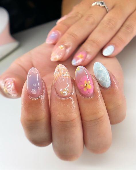 summer freestyle for maddie 🌺🫧🐚 i’m actually so in love with how this set turned out omg and it was so fun to make the water nail likeeee look how realistic?? love. #nails #nailart #summernails #summer #gelx #gel #gelnails #vbeautypure #apresgelx #après #vbp #nailinspo #nailinspiration #gelextensions #almondnails Glazed Nails Design, Nails Different Designs Each Finger, The Summer I Turned Pretty Nails, Water Nail Designs, Gel Nail Designs Natural Nails, Gel X Summer Nails, Nail Summer Ideas, Nails For Europe Trip, Fun Nails Summer