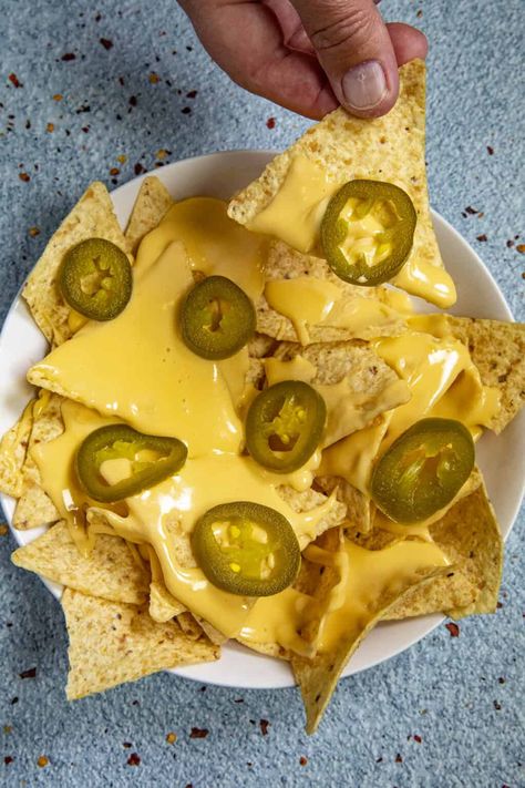 This spicy homemade nacho cheese sauce recipe is easy to make and tastes just like movie theater nachos with a trick I learned behind the concession stand. Easy Pickling Spice Recipe, Pickled Jalapenos Recipe, Nacho Cheese Recipe, Nacho Cheese Sauce Recipe, Easy Nacho Cheese, Homemade Nacho Cheese, Pickled Jalapeno Recipe, Jalapeno Recipe, Homemade Nacho Cheese Sauce