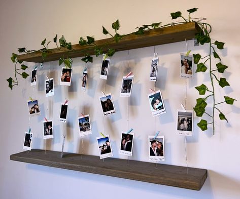 Handmade Polaroid Wall Shelf. Perfect gift idea for your loved one or a great way to organize and show off your polaroid photos while adding some soft ambiance in your room. Polariod Board Aesthetic, Wall Polaroid Ideas, Wall Decor Polaroid, Polaroid Display Ideas, Polaroid Wall Ideas, Instax Wall, Polaroid Pictures Display, Fun Apartment Decor, Polaroid Wall Decor