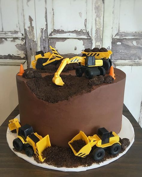 Construction Cake | Construction Birthday Cake  Chocolate and construction - what a perfect pair! This cake featured our chocolate cake, filled with white chocolate mousse and frosted in ganache. The cake was finished with what else but Oreo crumbs and cake truffles (disguised as rocks). Happy birthday Bulldozer Cake, Construction Birthday Party Cakes, Digger Birthday Cake, Digger Cake, Construction Birthday Cake, Construction Theme Birthday Party, Construction Cake, Truck Cakes, White Chocolate Mousse