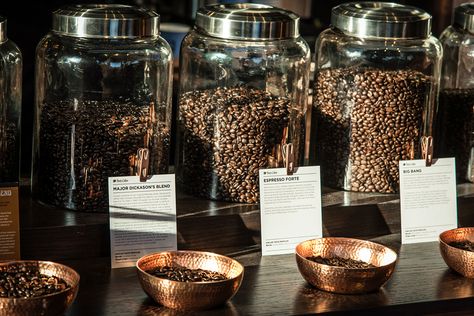 The objective of this project was to create an educationally engaging and sensory coffee bean experience with a new display in a new retail Flagship store in Georgetown. The hammered copper sampling bowls offer coffee enthusiasts the ability to fully imme… Coffee Bean Decoration, Retail Coffee Display, Coffee Store Design Interiors, Coffee Bean Display, Coffee Display Ideas, Coffee Beans Decor, Coffee Boutique, Coffee Education, Coffee Bean Shop