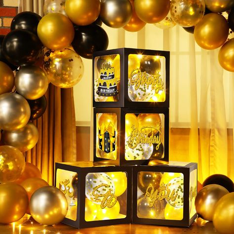 PRICES MAY VARY. Gold and Black Party Decorations Set: you will receive 4 pieces birthday balloon boxes with letters, each measures 11.8 x 11.8 x 11.8 inch, 8 pieces birthday cards with 2 sheets glue point dots, 35 pieces 5 inches balloons and 4 pieces 3.3 feet long warm white string lights, great for gold and black birthday party decorations Classic Design: the gold and black balloon boxes feature black transparent design, with "happy birthday to you" letters, and patterns like gift box, birthd Gold And Black Party Decorations, Black Birthday Backdrop, Gold And Black Party, Gold And Black Birthday, Balloon Boxes, Black Party Decorations, Women Birthday Party, Western Birthday Party, New Year's Party Decorations