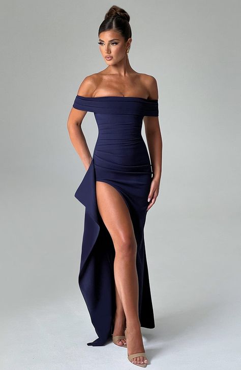 Simplicity at its most elegant in our Joyce maxi dress, cut from our luxury stretch crepe fabric. With a vintage feel, this dress sweeps over the shoulders with a pleated bardot neckline, while the bodice snatches your waist and hugs your curves to perfection with another pleat detail. We love the thigh high skirt split and elegant drape detail to the side.     Colour: Navy.  Stretch crepe fabric.  Moulds to your body.  Pleated bardot neckline.  Off the shoulder.  Draped detail thigh high split.