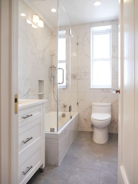 This bright and welcoming full bathroom in NYC has space constraints. Our custom white shaker style vanity was just the solution. Small Bathroom With Tube, Narrow Bathroom With Bath, Square Bathroom Layout With Closet, Narrow Washroom Ideas, Narrow Bathroom Makeover, Small Narrow Bathroom Remodel, Long Narrow Ensuite Bathroom, Long Bathroom Ideas Narrow, Small Rectangular Bathroom Ideas