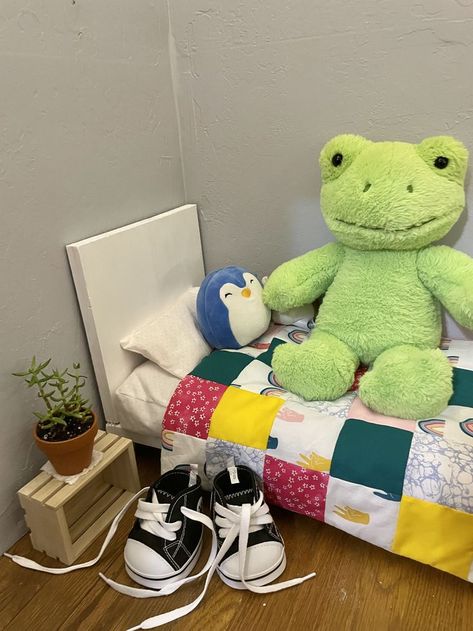 i repainted and cleaned the floors of a small space inside my closet, then i made the bed frame, mattress, pillow, and quilt. i love my build a bear frog so much, only the best for him! Build A Frog, Frog Stuff, Build A Bear Frog Aesthetic Outfits, Build A Bear Frog Room, Build A Bear Frog Clothes, Build A Bear Frog Crochet Clothes, Frog Build A Bear, Frog Pillow, Build A Bear Aesthetic