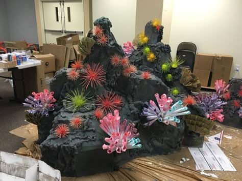 Fake rock , artificial , cardboard rock !! Made this for VBS this year- Theme is Deep Sea Discovery and i made 6 of this rocks. @ Opendoor Presbyterian Church #Coral reef rock- made out of cardboard boxes, foam spray, paint #Sea urchin-toothpick/skewer+foam ball #coral reef- paper cone Coral Reef Decor, Diy Coral Reef, Deep Sea Discovery Vbs, Ocean Commotion Vbs, Fake Coral, Paint Sea, Ocean Vbs, Under The Sea Decorations, Post Prom